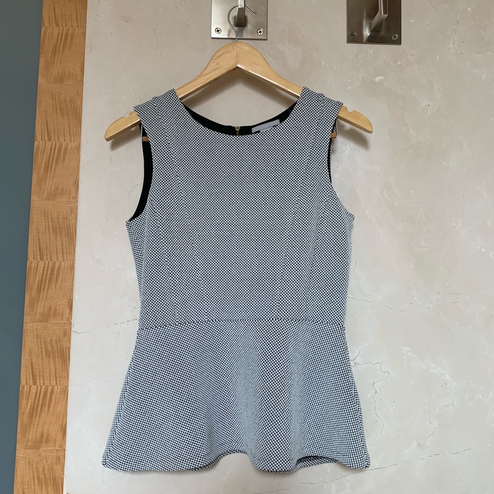 Never worn H&M Black and White Peplum Top w Zipper